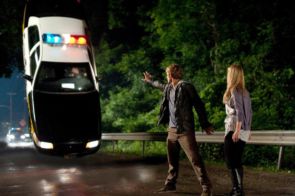 John, aka "Number Four" (Alex Pettyfer) shields Sarah (Dianna Agron) in "I Am Number Four."