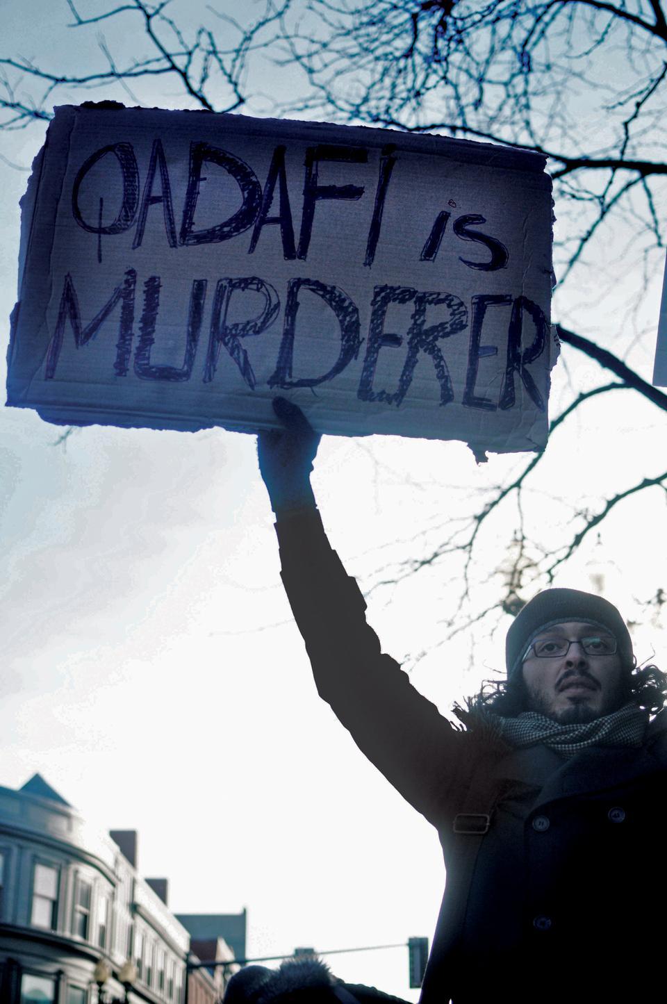 Protesters in the square enthusiastically, yet solemnly stand up for the rights of the citizens of Libya.