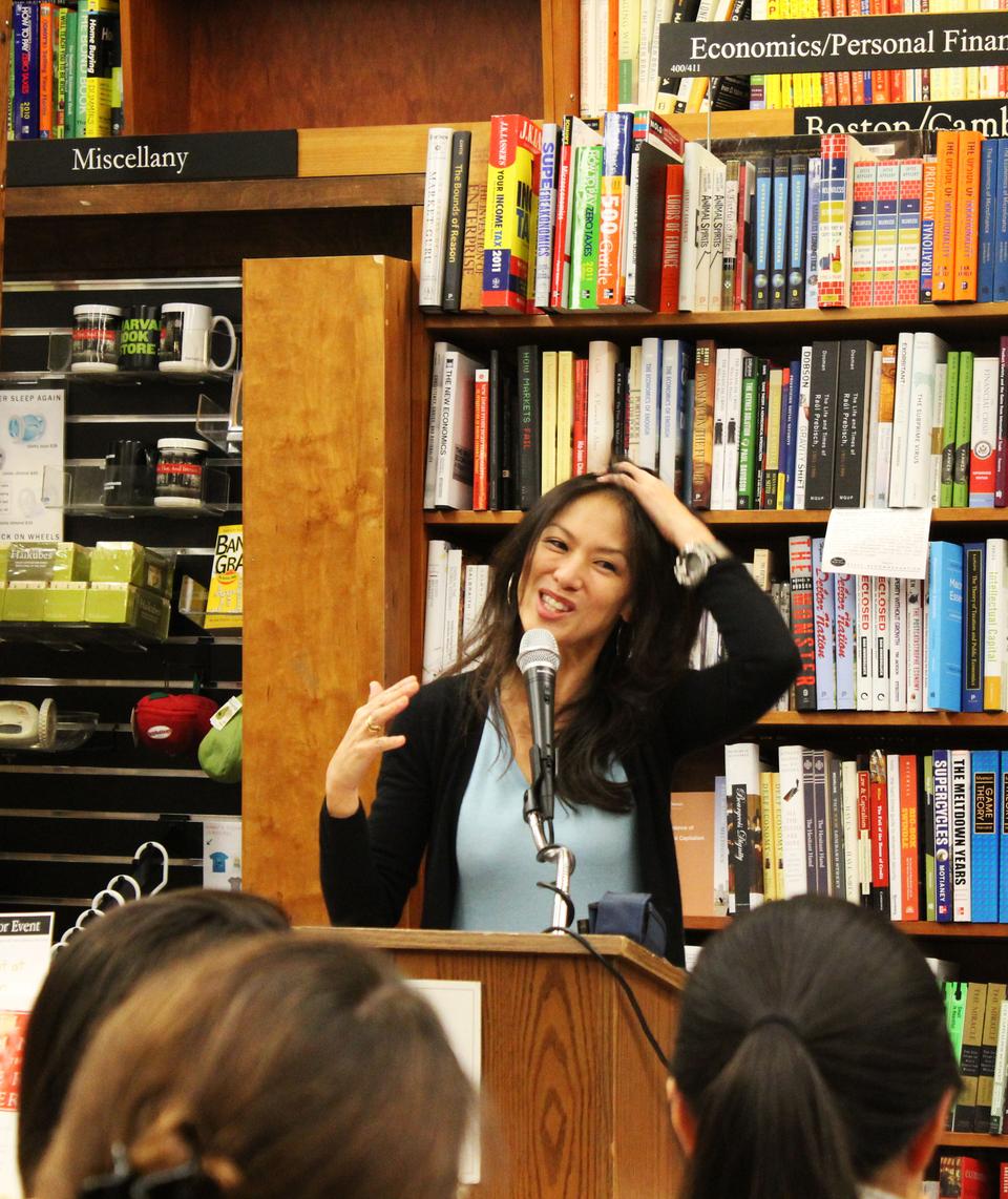 Amy Chua smiles at a reader's positive response to her memoir, The Battle Hymn of the Tiger Mother, during a question and answer session before her book signing at The Harvard Bookstore.