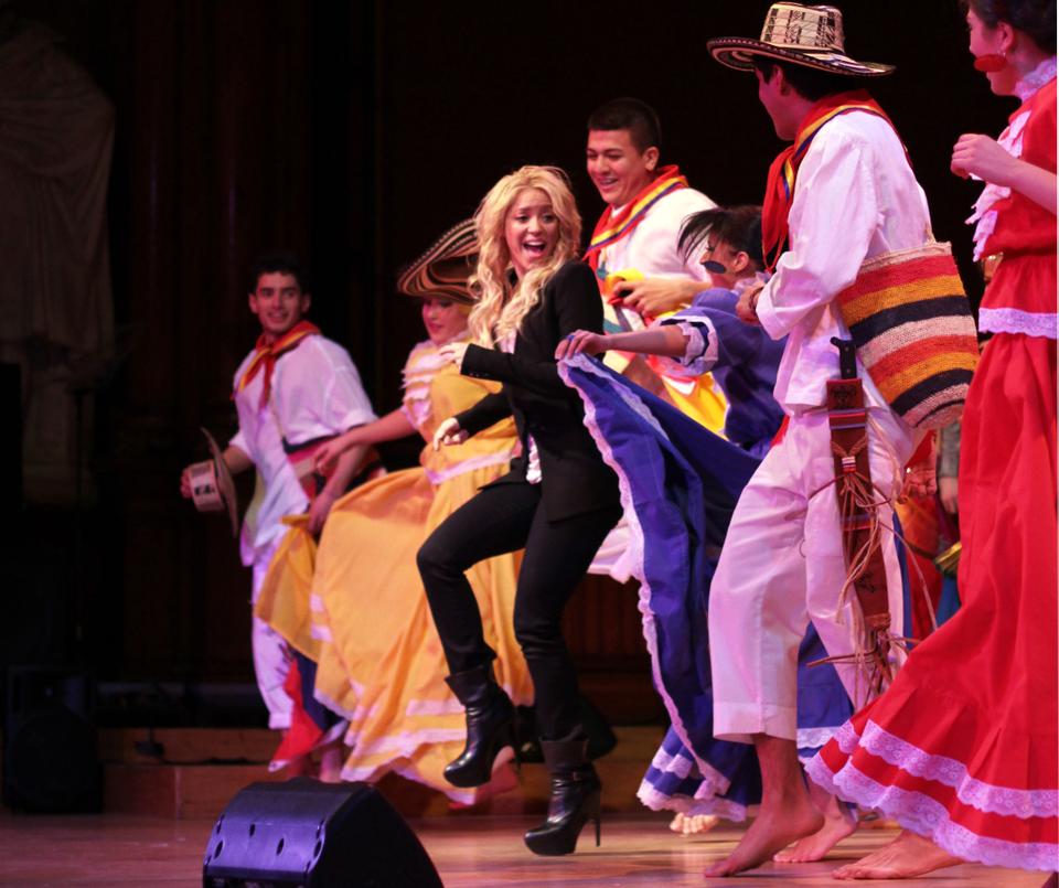 Shakira joins performers for an impromptu dance to a remix of the single "Waka Waka" at Cultural Rhythms Saturday.