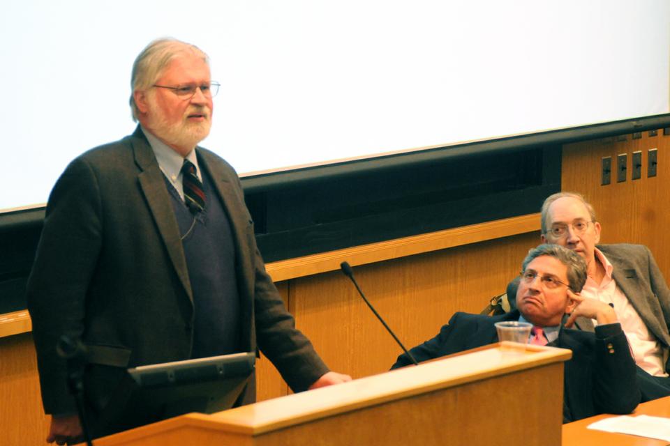 Douglas Massey of Princeton University gives a presentation on immigration issues, as Edward Schumacher-Matos and George Borjas of Harvard Kennedy School look on. 