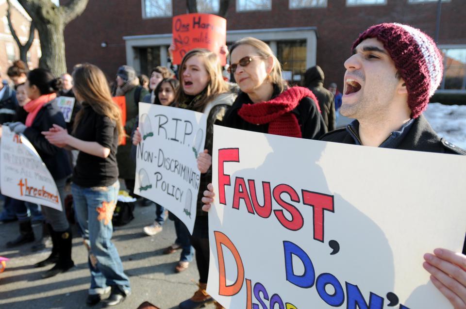 James Sares '12 (right) and others protest the return of ROTC because the repeal of "Don't Ask, Don't Tell" still does not allow trans-identified or intersex individuals to serve in the military. 
