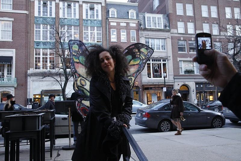 Shalhavit Simcha-Cohen dressed as a butterly walking in the streets of Boston.