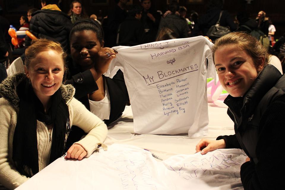 Brittanie H. Maxwell '14, Elizabeth M. Parker '14, and Whitney A. Lee '14 pose for a photo as they commemorate the eve of Housing Day by making personalized t-shirts.