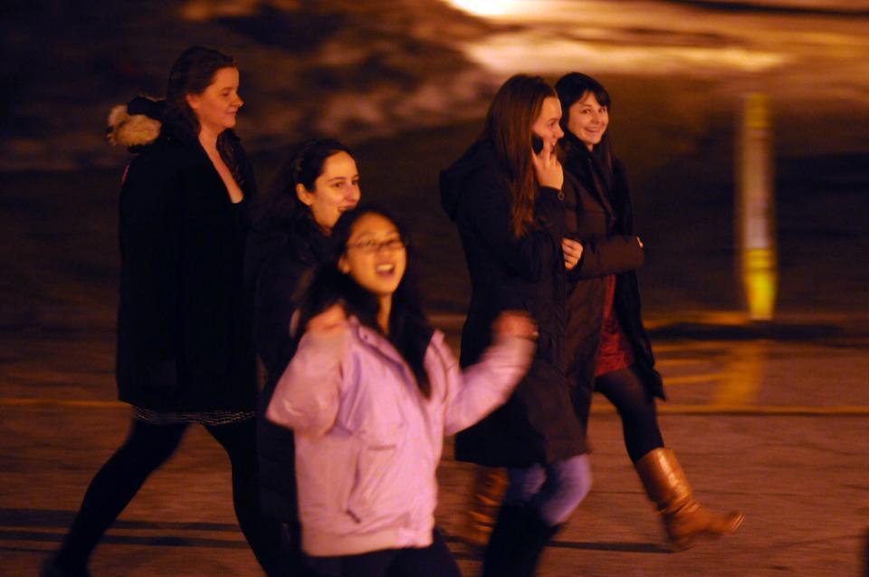 Freshmen walk across the MAC Quad during River Run festivities. Despite warnings, many freshmen still ventured out of the yard in an effort to please the "housing gods" last night. 