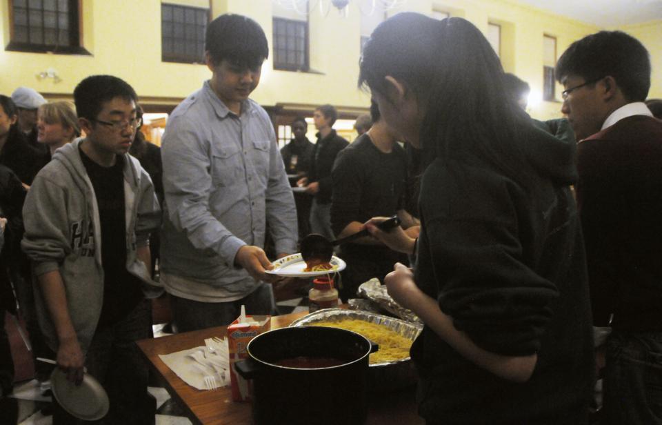 Students line up at a buffet during a benefit dinner in support of disaster relief efforts in Japan. Organized by Harvard Students for Japan, the dinner was held Saturday night at Winthrop dining hall. Proceeds will be donated to the Red Cross.