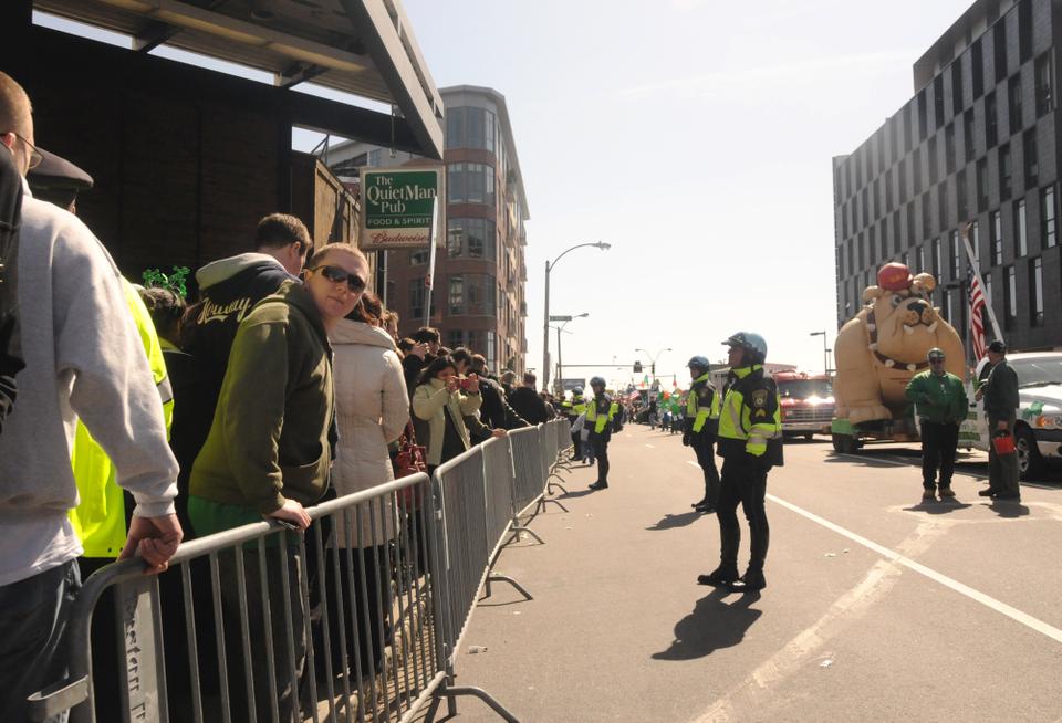 Boston Police help to contain the continuous flow of people coming off the T station. The Broadway stop on the subway's red line marks the beginning of this year's parade which started at 1:00pm.
