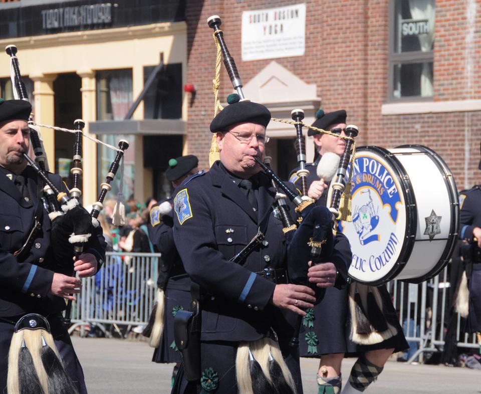The Boston Police Department's bagpipe band play a tribute to St. Patrick's Day. This organization, known as 'Gaelic Column of Pipes and Drums,' specializes in the traditional music of the Gaelic culture.
