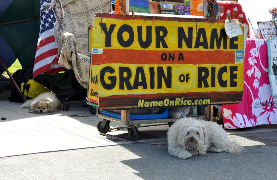 Vendors set up booths along the boardwalk to sell souvenirs.  Oftentimes they’ll bring furry friends to keep guard over their stations while they’re out running errands.