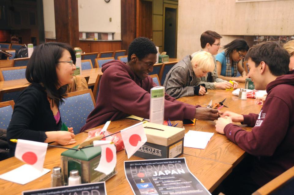 Students explore the complex art of origami as a part of a study break workshop during Harvard for Japan Week on Tuesday, March 22, 2011 in Quincy Dining Hall. Their goal is to fold one thousand paper cranes. Known as "Senbazuru" in Japanese, a thousand paper cranes symbolize a wish for speedy recovery from disaster or illness.