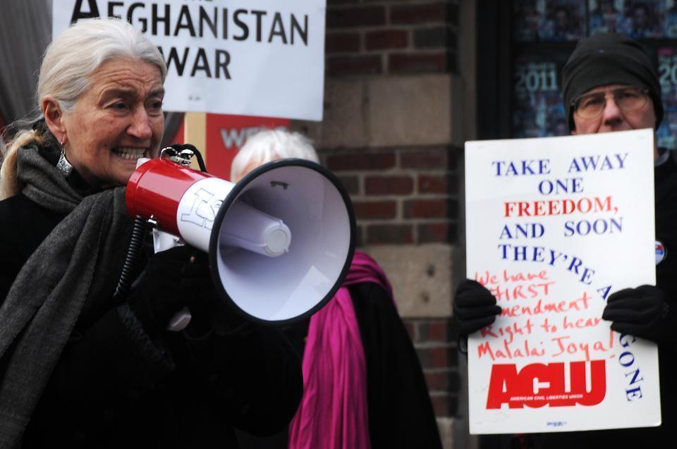 Nancy Murray rallys activists in Harvard Square yesterday, chanting "Let Malalai Joya Speak!"