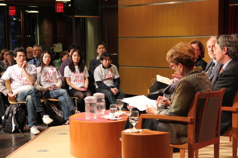 Wearing shirts with the words “Stand with Japan,” audience members listen as Harvard Professors and the Consul General of Japan discuss the recent earthquake in the John F. Kennedy Jr. Forum at the Kennedy School of Government.