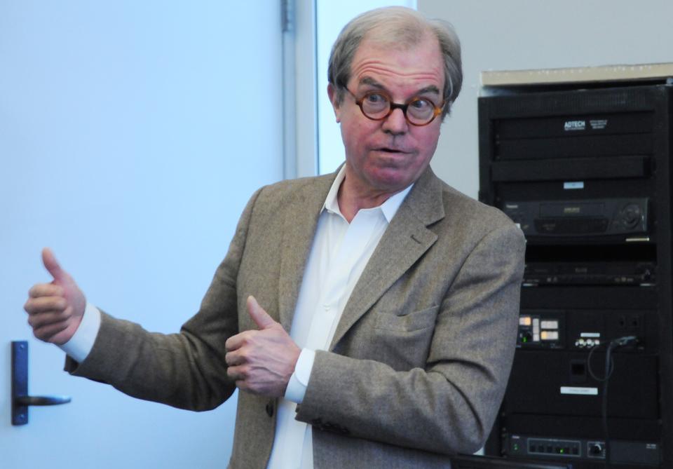 Nicholas Negroponte, founder of One Laptop Per Child, discusses his social enterprise company and the difficulties it has encountered before an audience of student leaders in Harvard Hall.
