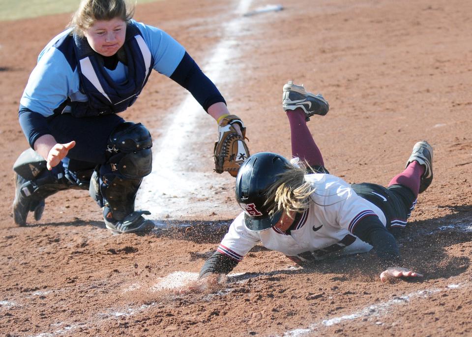 Sophomore outfielder Ashley Heritage slid safely into home yesterday afternoon during the Crimson’s sweep of Rhode Island at Soldiers Field. Heritage, who is third on the team with 11 runs this season, finished the afternoon with two runs and two hits on four plate appearances.