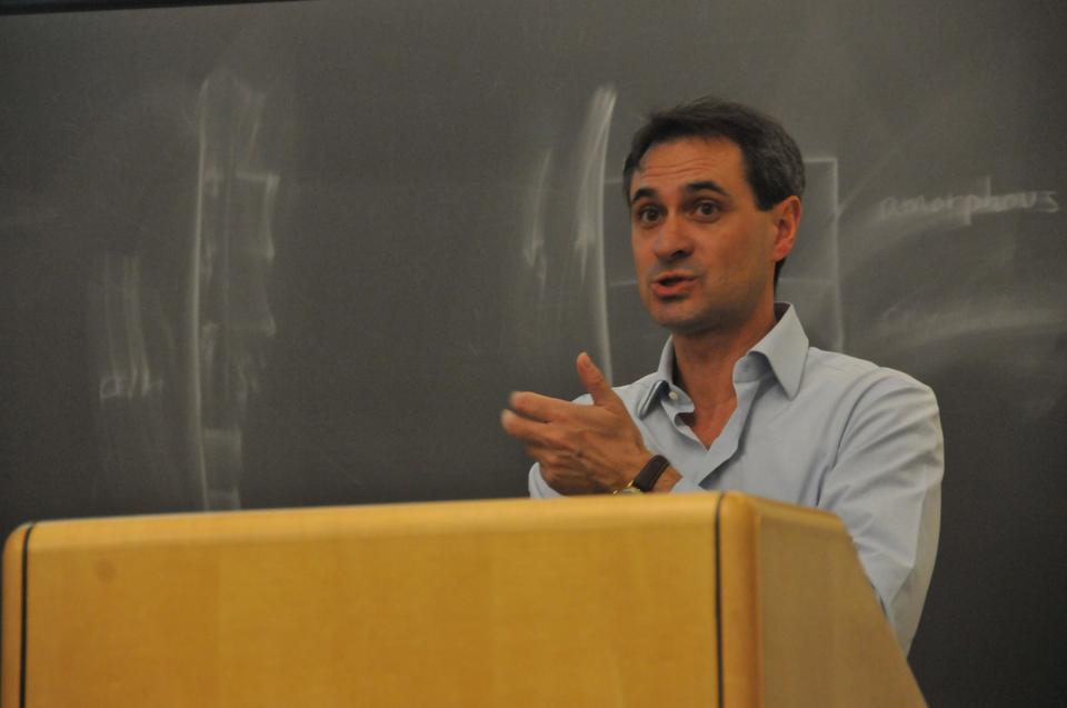 Professor Dario Floreano, Director of the Laboratory of Intelligent Systems at the École Polytechnique Fédérale de Lausanne in Switzerland, describes current research in flying robots at Maxwell-Dworkin yesterday.