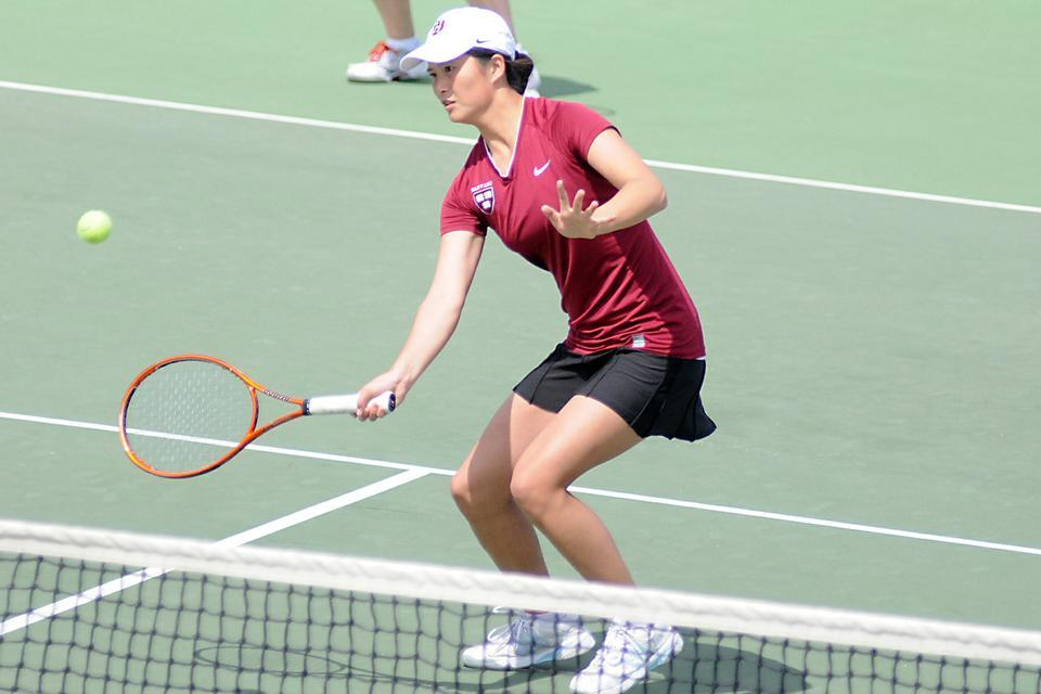 Junior co-captain Holly Cao, shown above in previous action, was undefeated at No. 1 singles this weekend against No. 36 Yale and No. 45 Brown, but the standout lost both of her No. 2 doubles matches. The Crimson hung on for a narrow win against the Bears to stay in the Ivy League title hunt.