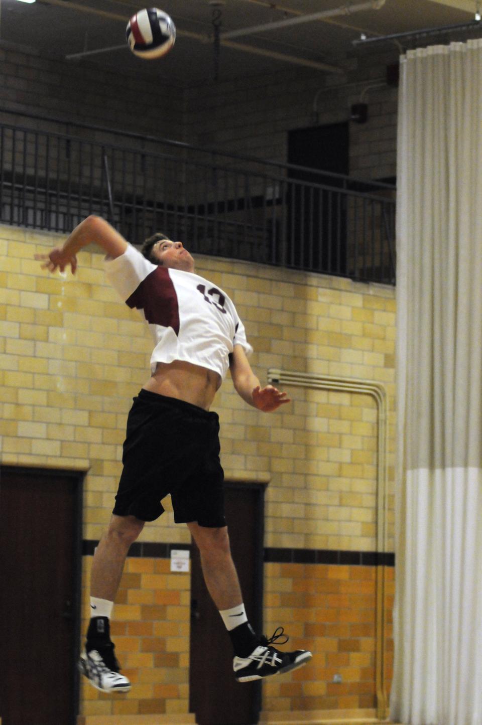 Shown here in earlier action, junior co-captain Matt Jones tallied a match-high 24 kills to go along with two service aces, five digs, and six blocking assists Saturday afternoon at home. He helped the Crimson close out its season on a high note, defeating NJIT in four sets for its first conference win of the year.