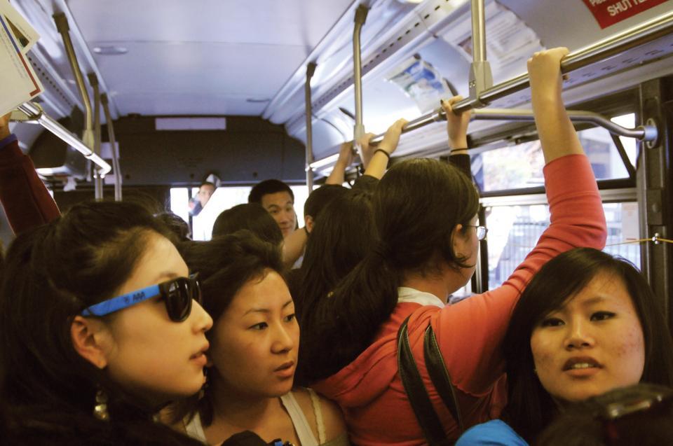 Admitted students of Harvard’s Class of 2015 and current Harvard students stand in an overcrowded shuttle, a common problem during Visitas, the visiting program for prospective students.