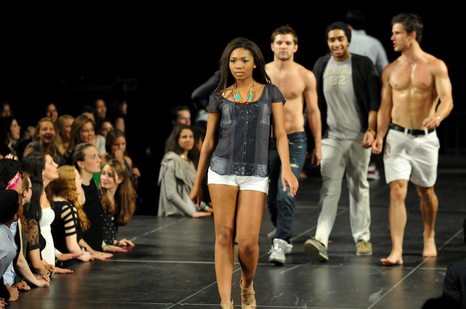 Jordan E. McNulty ’13 takes center stage on the catwalk in between skits at Eleganza.  