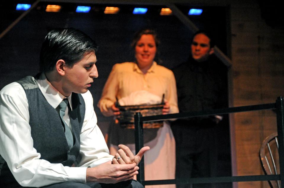 The factory owner accused of murdering a thirteen year-old employee, played by Elliot J. Rosenbaum '12, sits nervously in his jail cell.