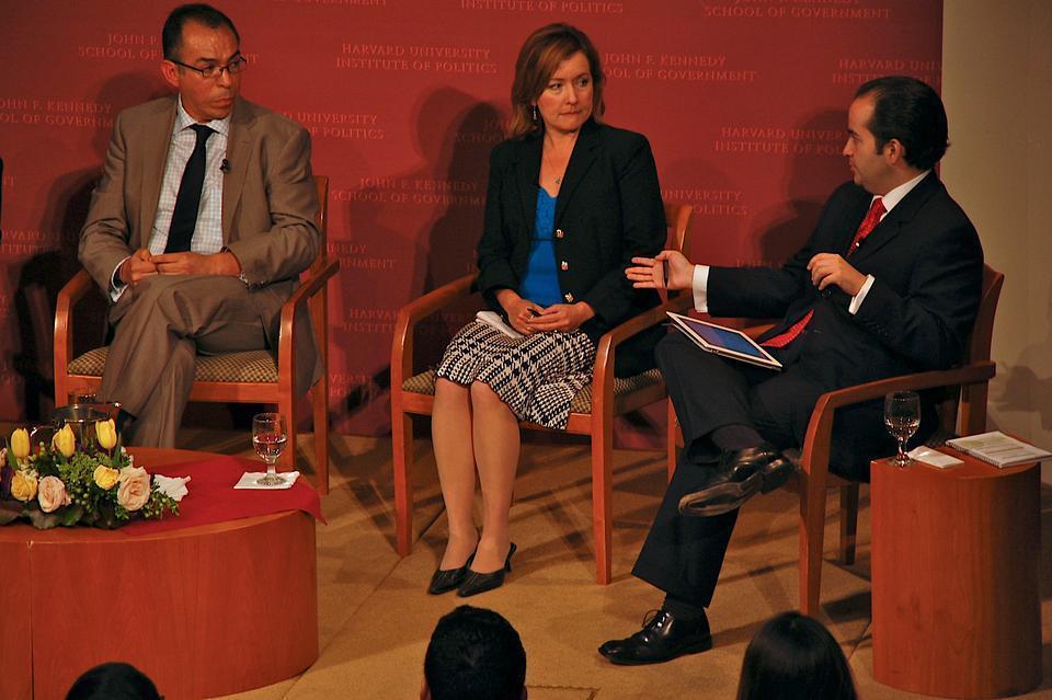 Alfredo Corchado, a 2009 Nieman Fellow, and Angela Kocherga listen as Alejandro A. Poire Romero '02, of the Mexico National Security Council discusses the response of the Mexican government to drug-related gang violence in Mexico at the IOP yesterday. According to Poire, "90 percent of [drug-related, violent] crimes occur in local jurisdiction."