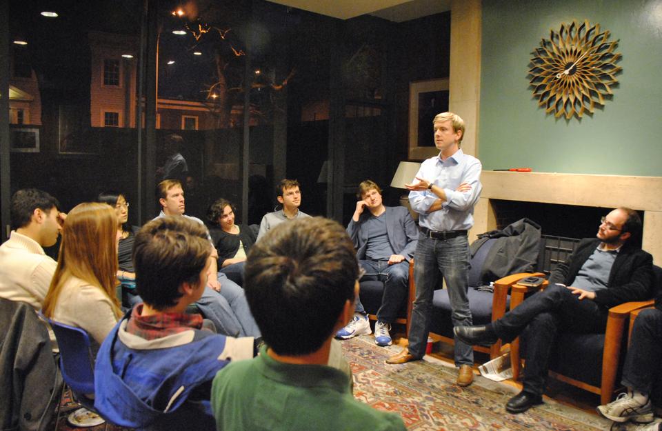 Facebook co-founder Chris R. Hughes ’06 discusses his new project, Jumo, a social networking site for non-profit organizations, in the Quincy House senior common room.