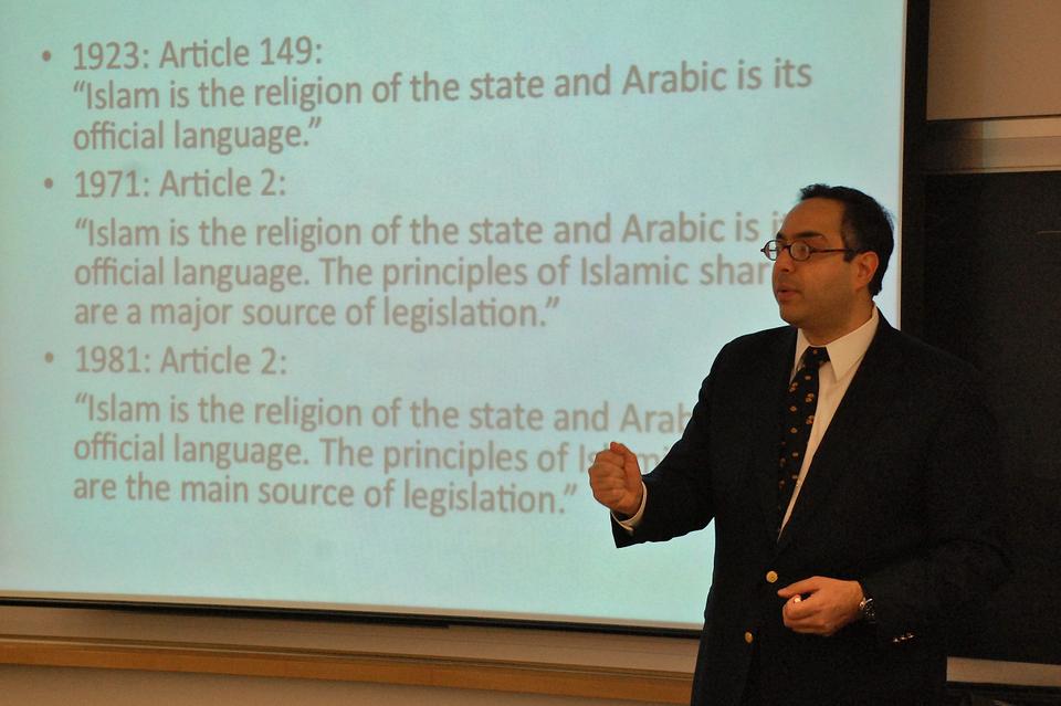 Tarek Masoud, Assistant Professor of Public Policy, Ash Center for Democratic Governance and Innovation, John F. Kennedy School of Government, gives a brief history of the role of Islam and Sharia Law in the Egyptian Constitution, an important issue in upcoming elections, during his presentation in the Bowie-Vernon Room of CGIS on Thursday.