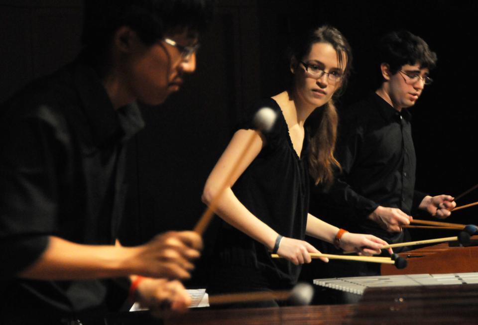Rachel Wagley '11 looks at a fellow performer during The Harvard Undergraduate Drummers' spring show, THUD Robots.