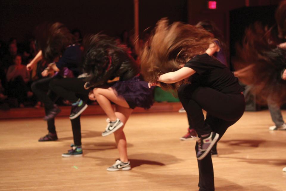 Cristina E. Alcorta '12 flips her hair back as she dances in one of the pieces during the show. 