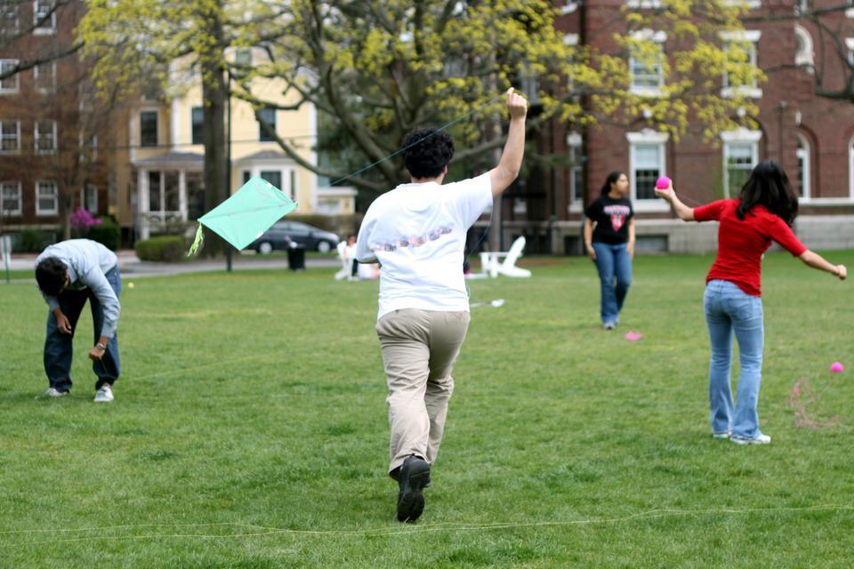 Students from Harvard's Hindu Student Association, Dharma, fly kites on the quad lawn as part of their annual Kite Festival yesterday, held in celebration of Makar Sankaranthi, a kite-flying festival popular in Gujara, India.
