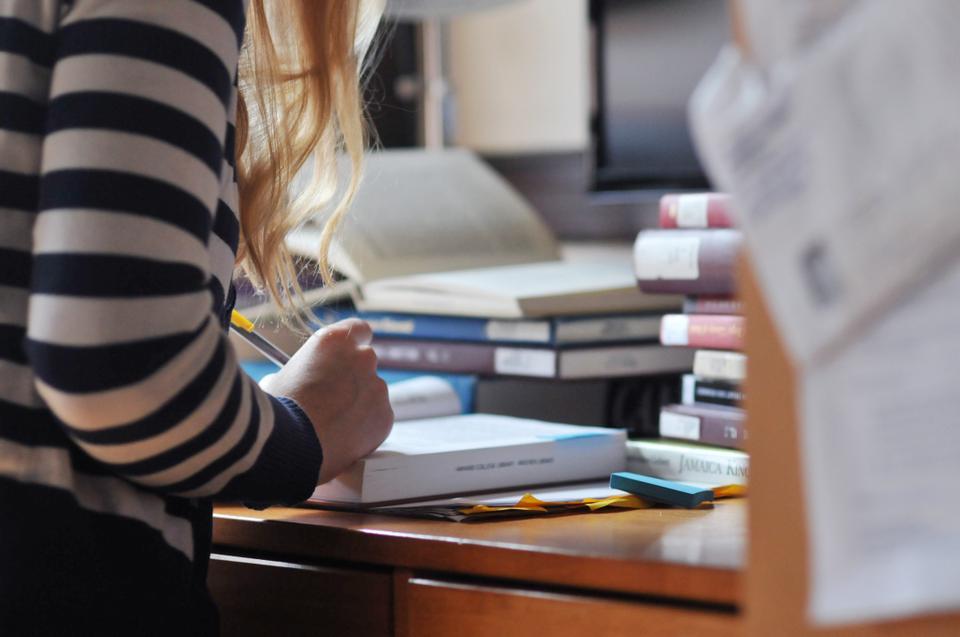 Sarah L. McCuskee '13 works diligently on a paper for her tutorial in literature.  