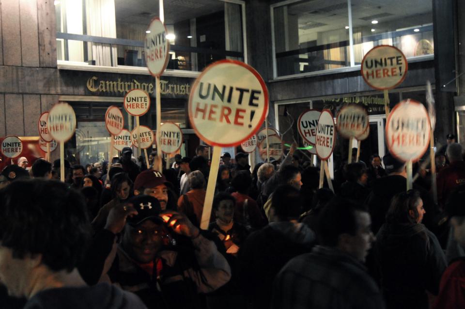 Yale University dining hall workers and students join their Harvard counterparts for a union demonstration in Harvard Square on Thursday night. The protest followed a meeting and discussion and a negotiation session between Unite Here Local 26 and the University.