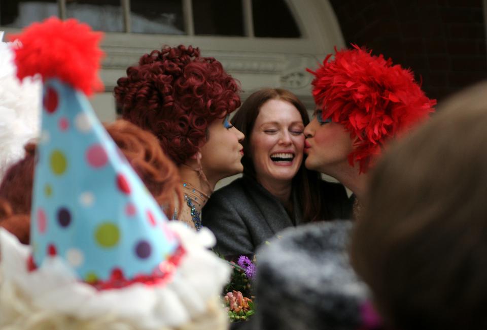 The Hasty Pudding Theatrical’s Woman of the Year Julianne Moore receives kisses from members of the cast of “Kashmir If You Can” outside of the New College Theatre on Jan. 27, 2011. 