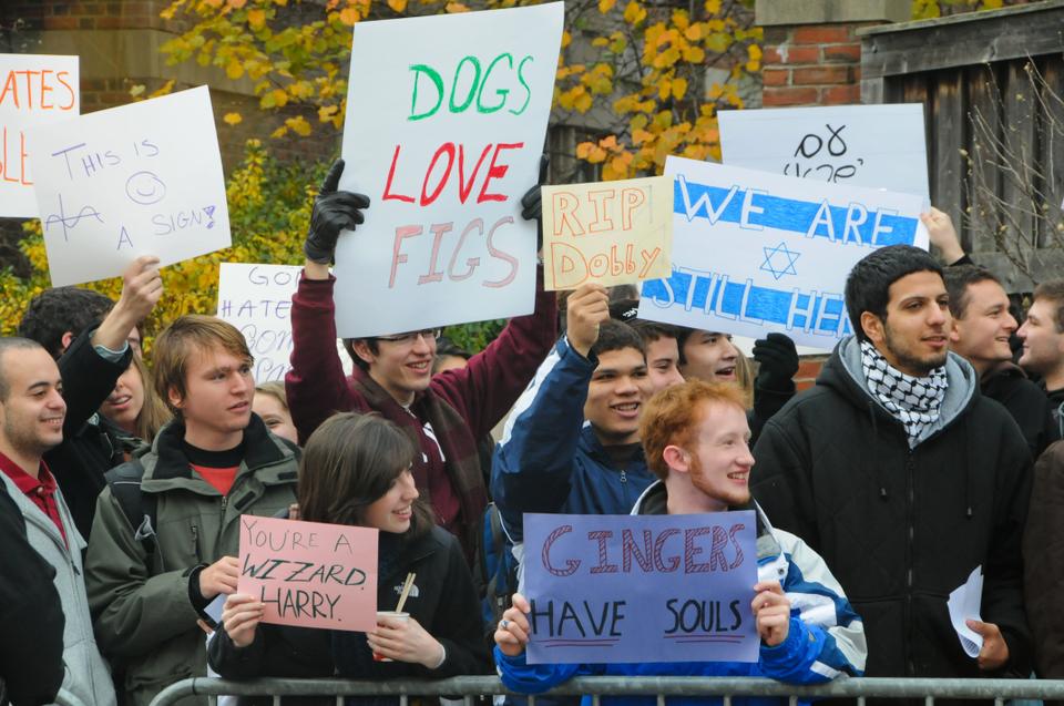 Students and members of the Harvard community hold purposely nonsensical signs outside Harvard Hillel on Dec. 6, 2010 to maintain a positive community and spirit during the Westboro Baptist Church’s protest.