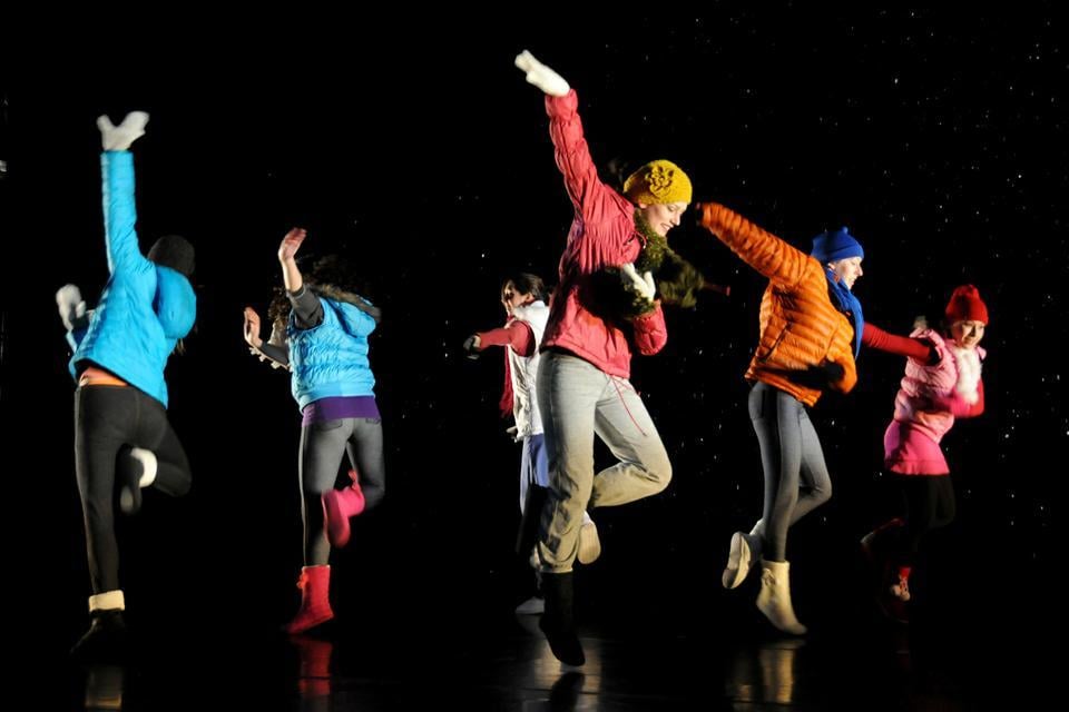 Dancers aren't fazed by winter! They dance jubilantly in warm coats and winter accessories in the first half of "sprangsprangsprung," complete with a backdrop of falling snow as part of Dancer's Viewpointe.
