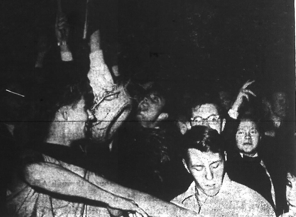 Students rioting outside of Widner library in protest of the administration's decision to  change the language of the diploma's from Latin to English.