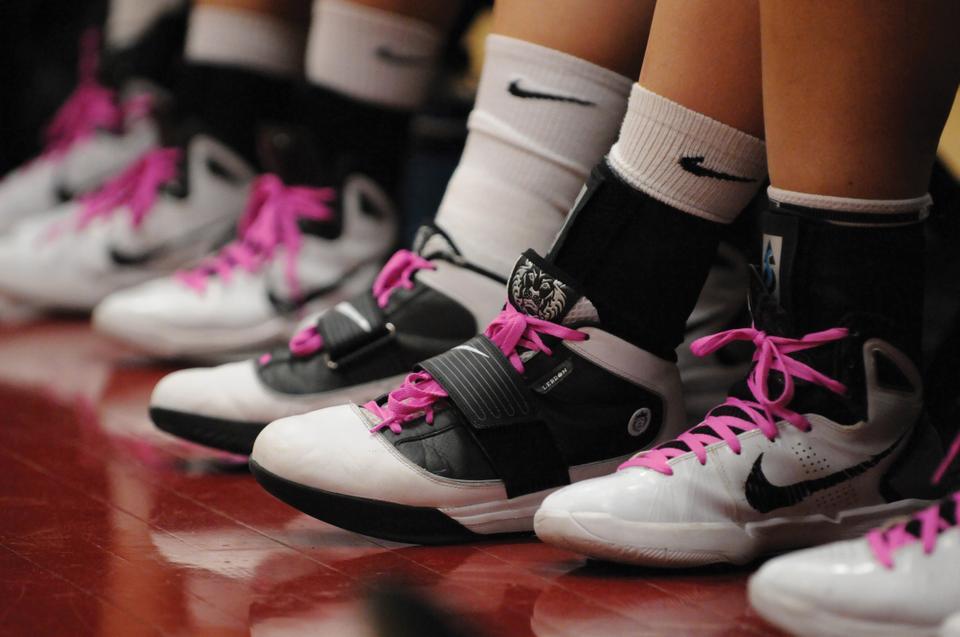 Members of the Harvard women's basketball team wear pink shoelaces and headbands at the fourth annual Pink Zone game. All proceeds went to the Kay Yow WBCA Cancer Fund