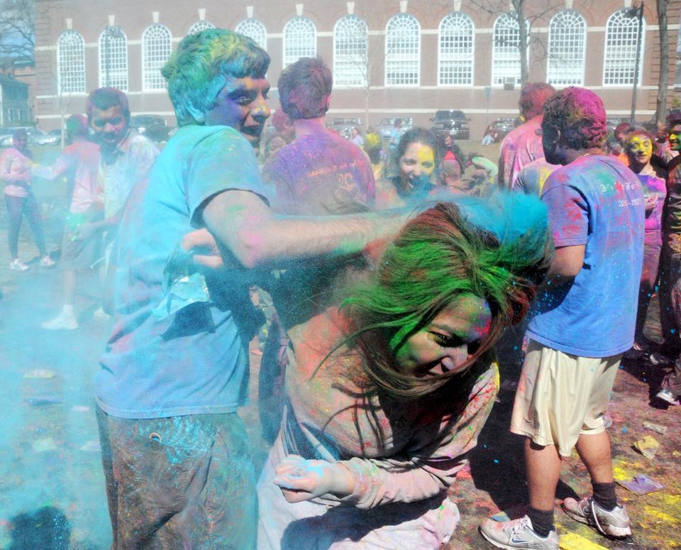 Students throw colorful powder at each other on the MAC quad during Holi, the traditional Indian celebration signifying the beginning of spring. The powder, called “rang”, was imported from India for the event.
