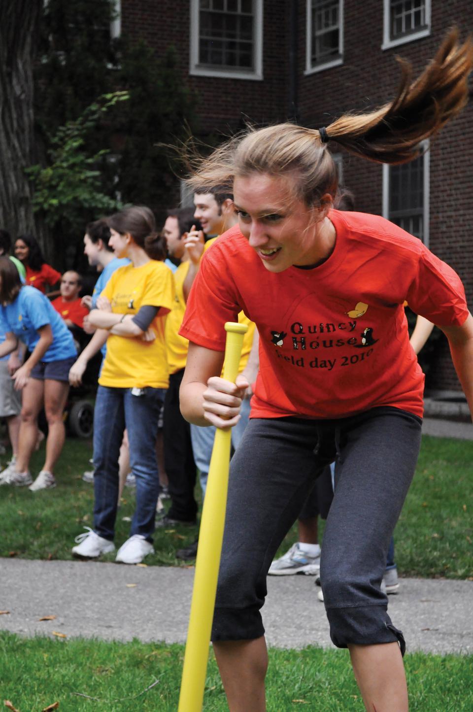 Jaime L. Olson '11 plays "dizzy bat" in the Quincy House courtyard as part of Quincy's annual Field Day.