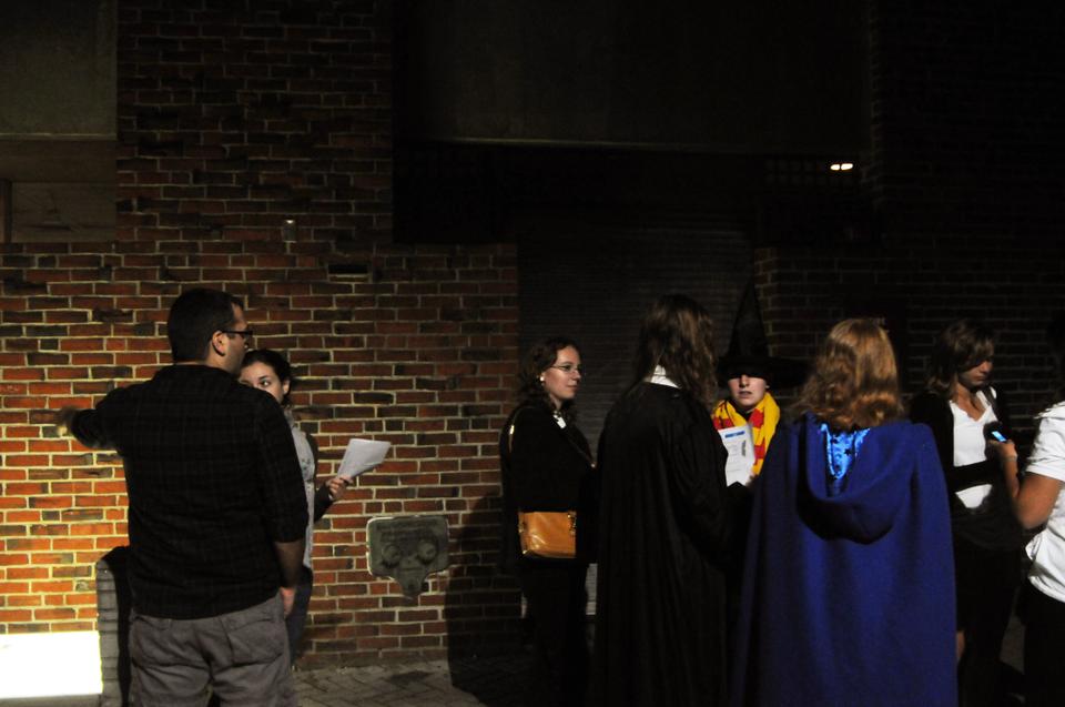 In the alley between JFK Street and Church Street, moviegoers wait on line to see the new Harry Potter movie.