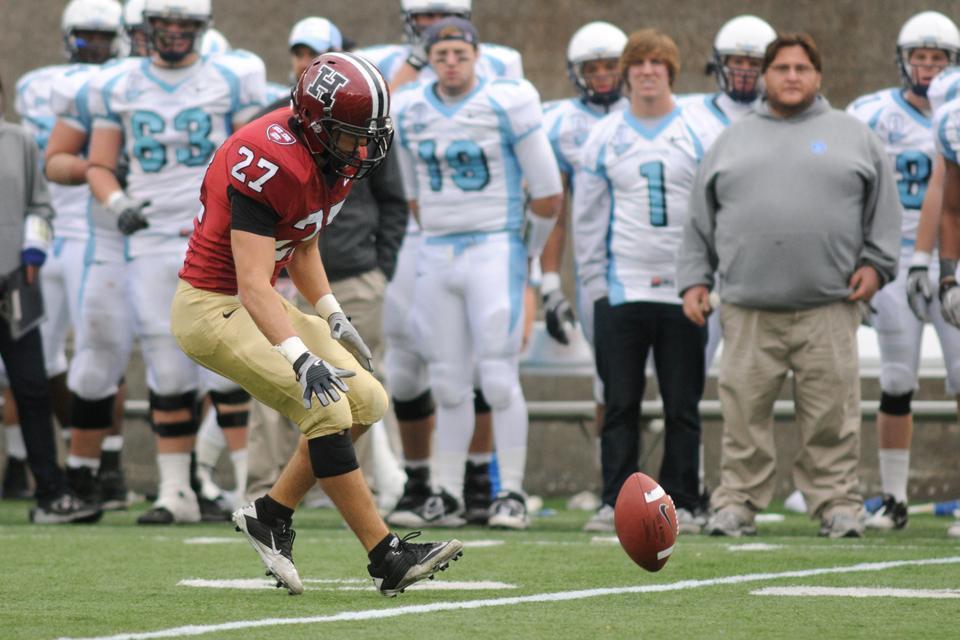 Collin Zych ’11, shown here during his Harvard years, was recently cut from the Dallas Cowboys’ regular season roster. Despite also working in finance, he maintains a shot at making the team’s practice squad. 