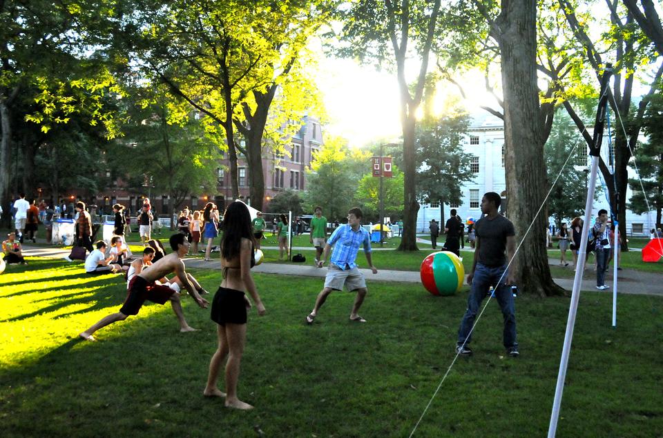 Students play with volleyballs and inflatable beach balls at Friday evening's "Cape Crimson" event, held as this year's welcome back celebration for students. 