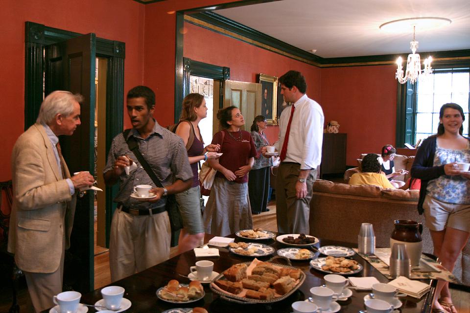 Students, staff, and other members of the Harvard community converse and enjoy tea and treats during Wednesday Tea at Sparks House, a tradition started by the late Rev. Prof. Peter Gomes.