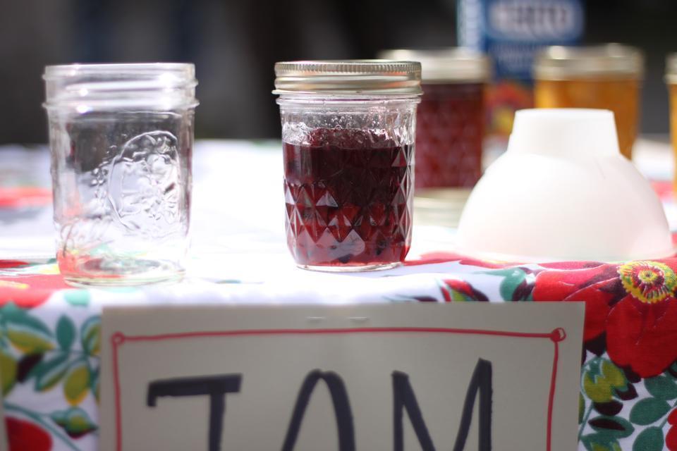 "It's about getting people excited about old-fashioned skills, which people in the city are becoming interested," says Alexa Photopoulos '05, standing at the jam booth.