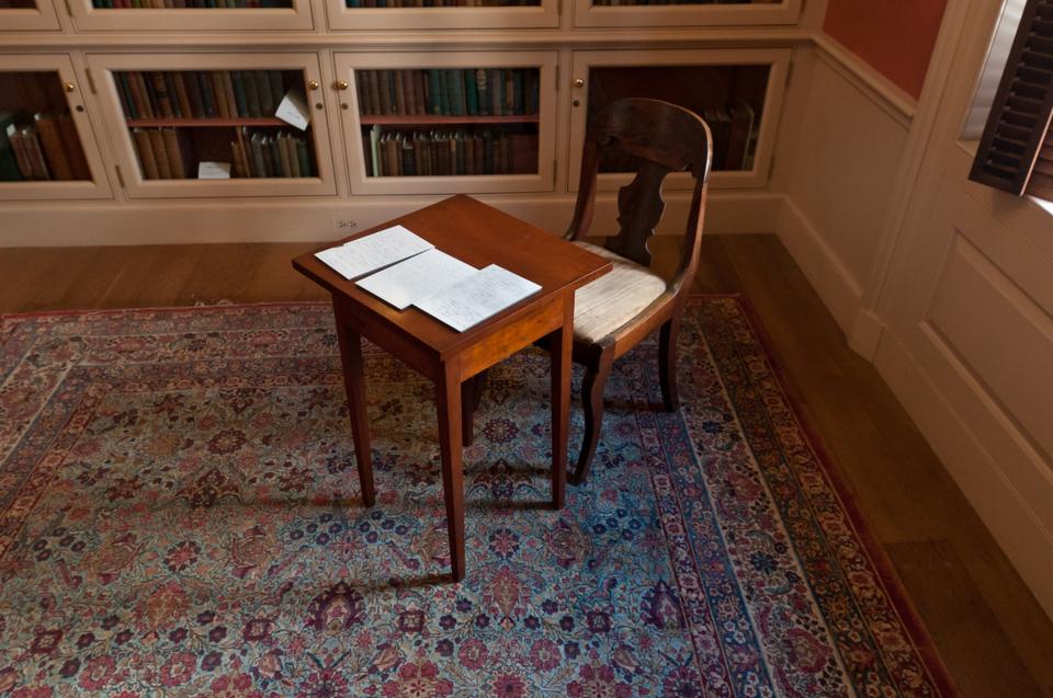 The Emily Dickinson room at Houghton Library features many letters, poems and artifacts of the nineteenth century writer.  Also displayed in the room are actual furnishings from her home, including her writing table and chair (pictured)