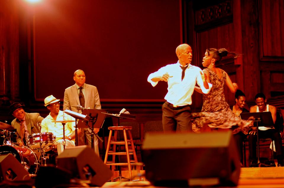 Wynton L. Marsalis looks on as performers demonstrate popular dances from the 1930s during his lecture,  “The Double Crossing of a Pair of Heels”, in Sanders Theater on Thursday.