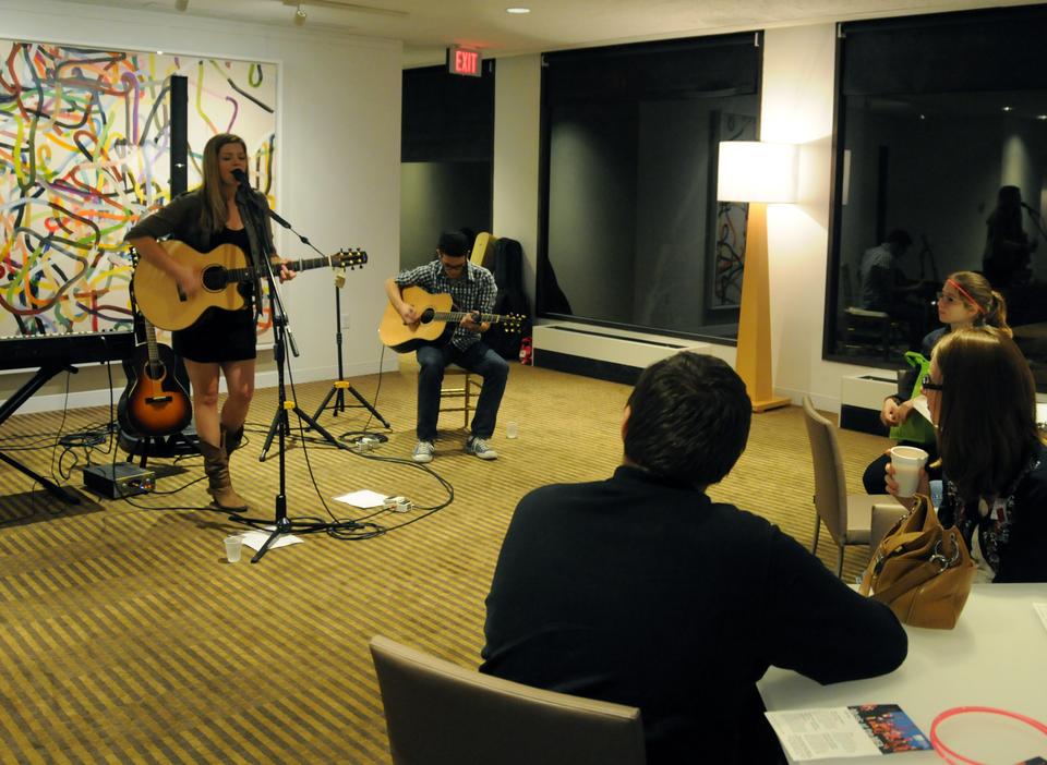 Liz Longley, grand prize winner of the International Acoustic Award, performs for an attentive crowd of college students taking a break from the art exhibitions. 