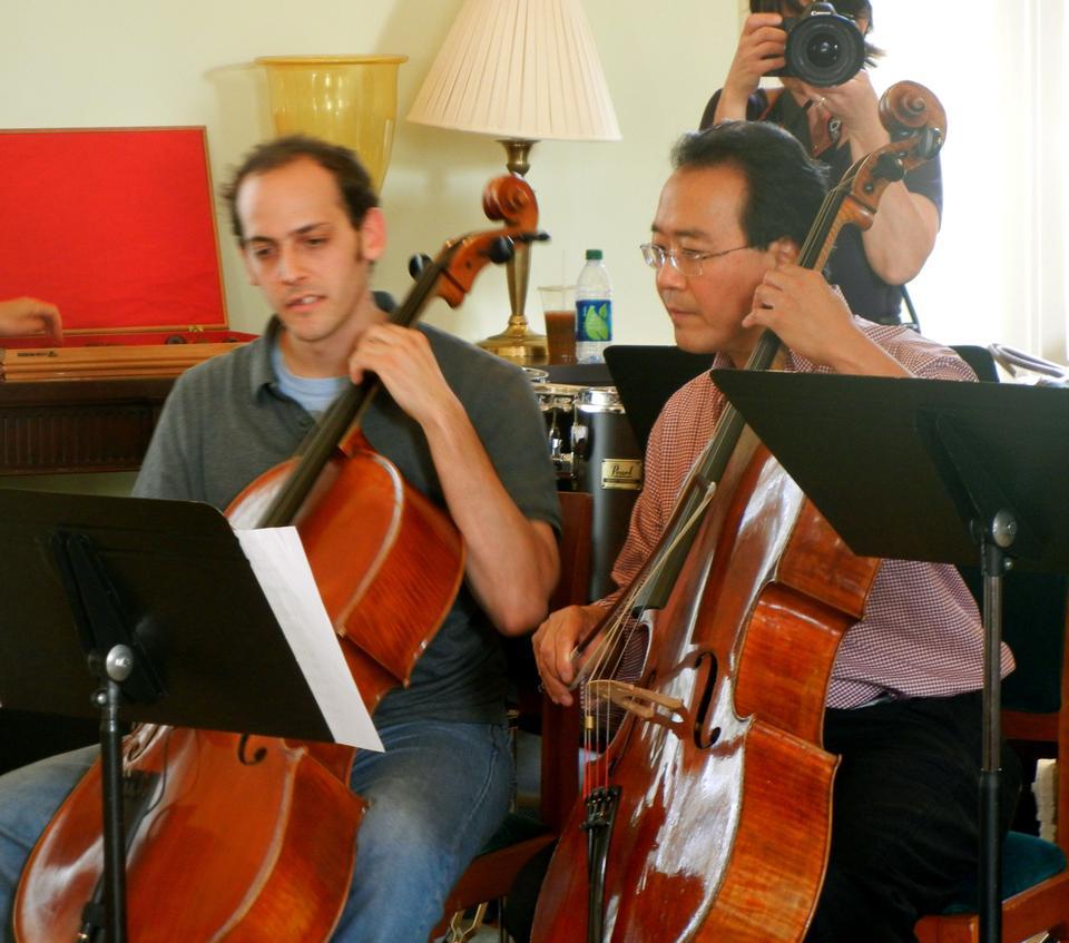 Cellists Mike Block and Yo-Yo Ma '76 perform at Spangler Center at the Harvard Business School on Monday. The Silk Road Ensemble is a collective of internationally renowned performers and composers from more than 20 countries.