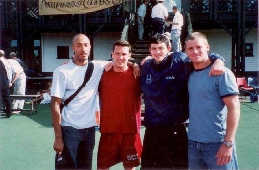 Harvard football alum Eric LaHaie ’02 (in red) is racing in the Sahara in honor of his late teammate and friend, Niall Murphy ’02 (dark blue jacket).
