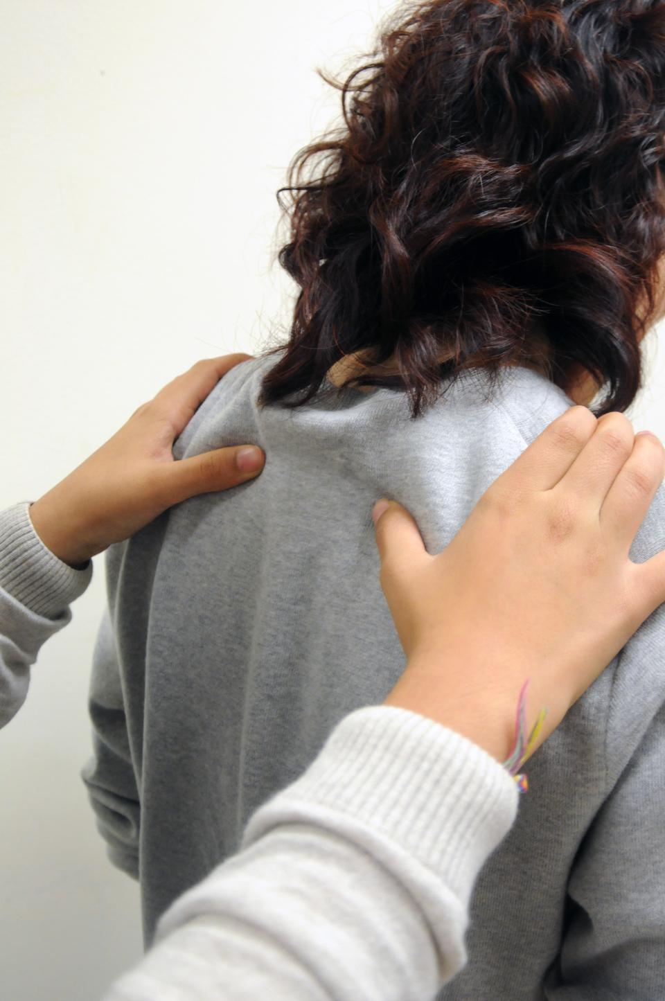 Rub your thumbs in circular motion along the person’s back or shoulders. Focus on the sides of the spine, but don’t massage directly on the vertebrae.

